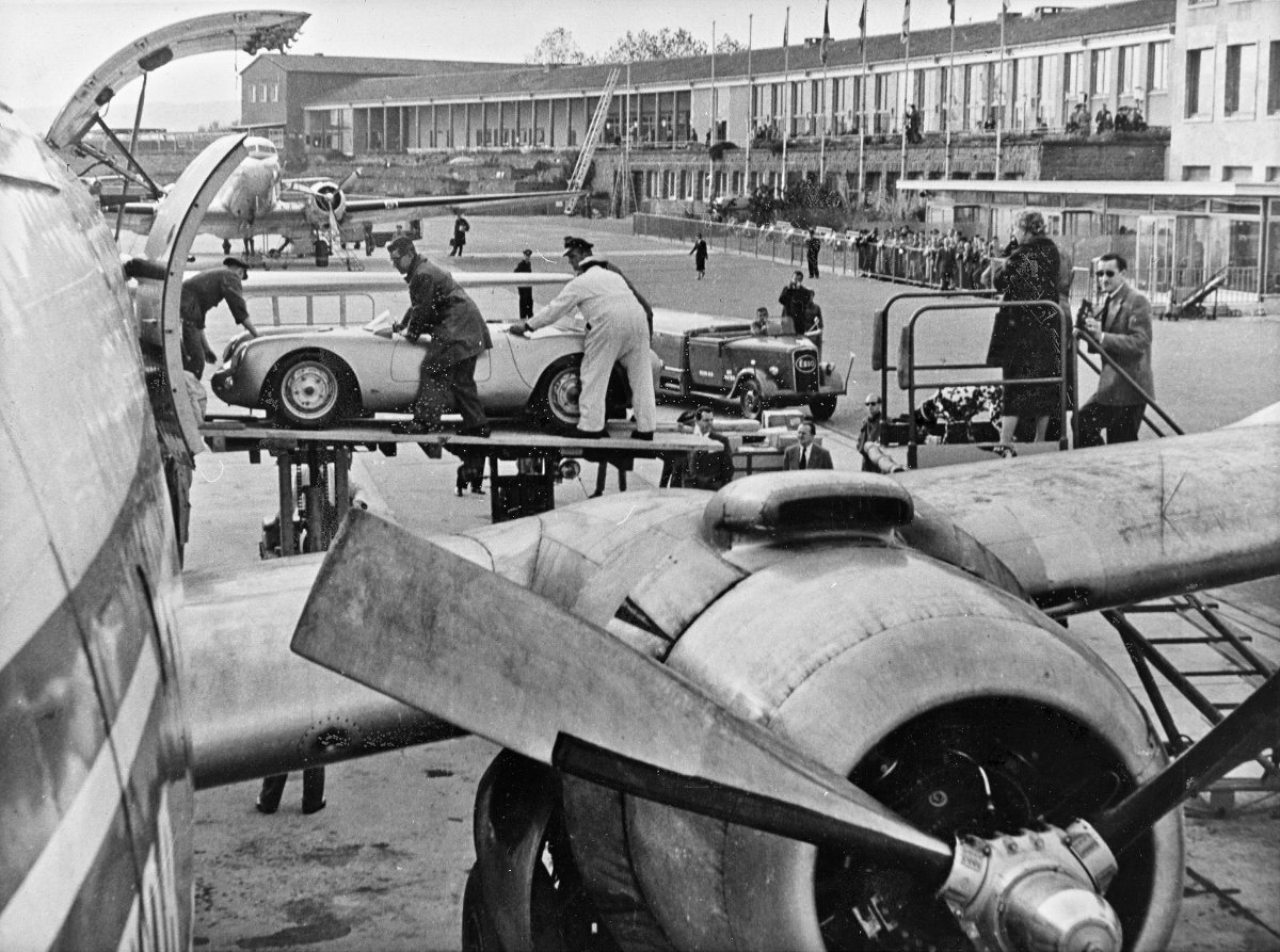 A Porsche 550 Spyder loaded onto an aircraft